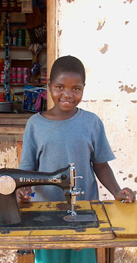 African Child with Singer Sewing Machine, Malawi, Around 2000