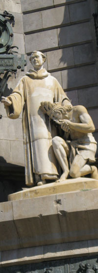 Statue of Spanish Missionary and Native American on Christopher Columbus Monument Statue of Spanish Missionary and Native American on Christopher Columbus Monument