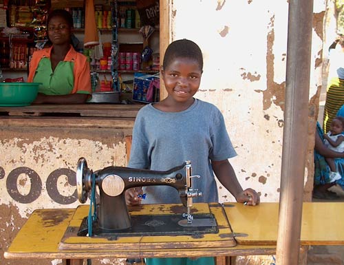 African Child with Singer Sewing Machine, Malawi, around 2000