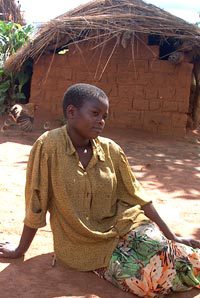 African Woman in Courtyard by House, Malawi, Around 2000