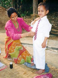 Mother Preparing Child for School, Nepal, Around 2000