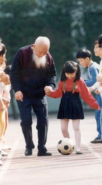 Elderly Man and Girl Playing Soccer, Taiwan, 1980s